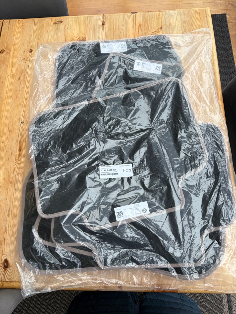 BMW brand new x1 one cloth, formats, black, and tan outline, package not opened